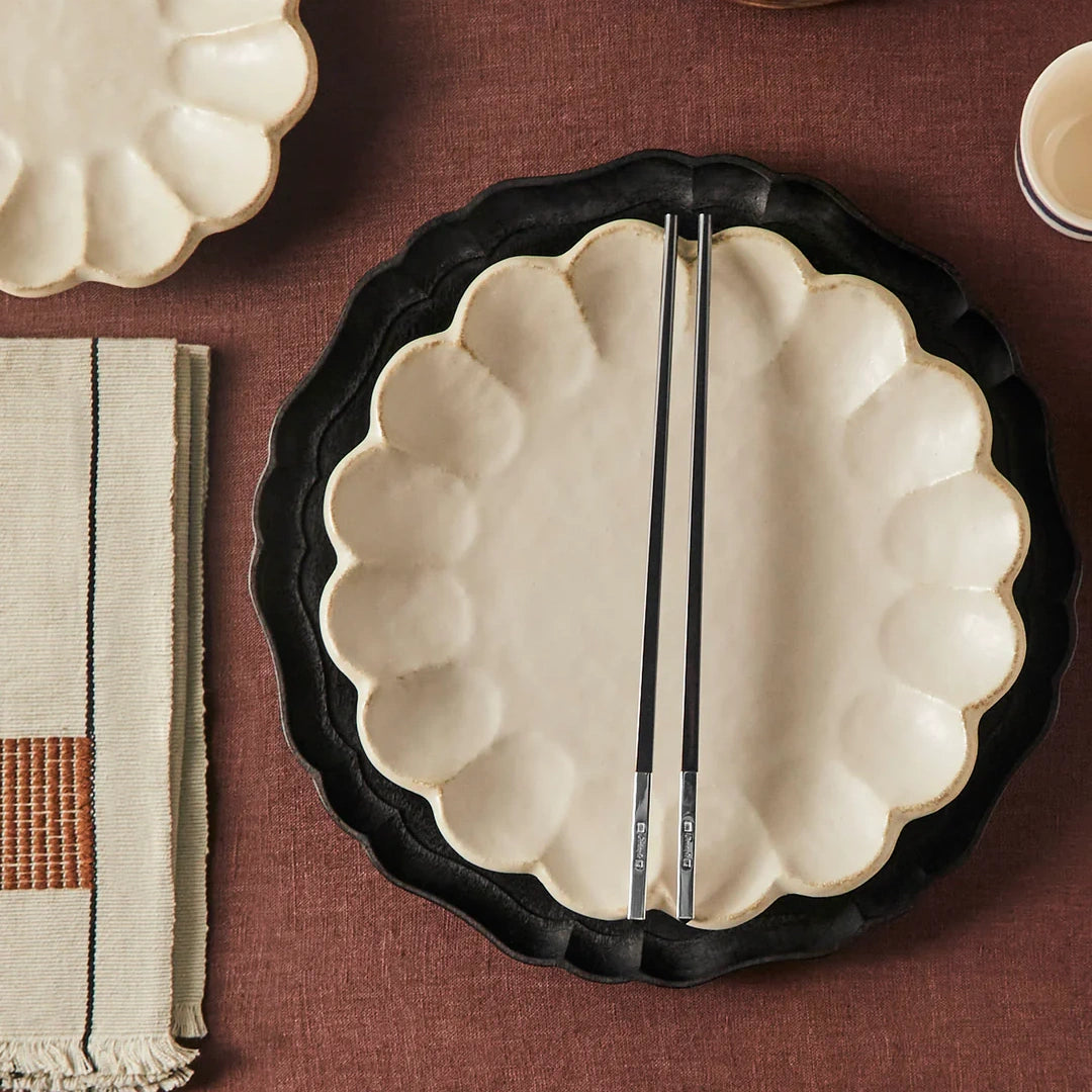 Handcrafted Japanese ceramic dish with scallop edge design