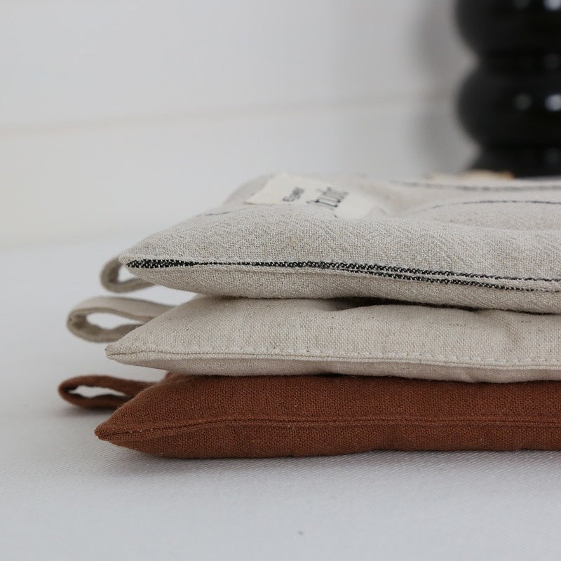 Handcrafted Japanese-inspired texture detail on natural linen coaster surface.