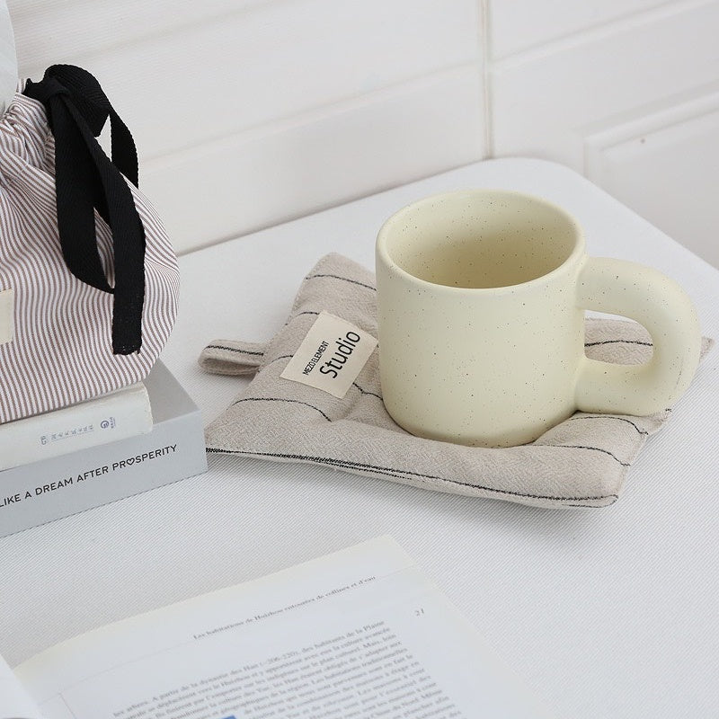 Handcrafted Japanese-inspired texture detail on natural linen coaster surface.
