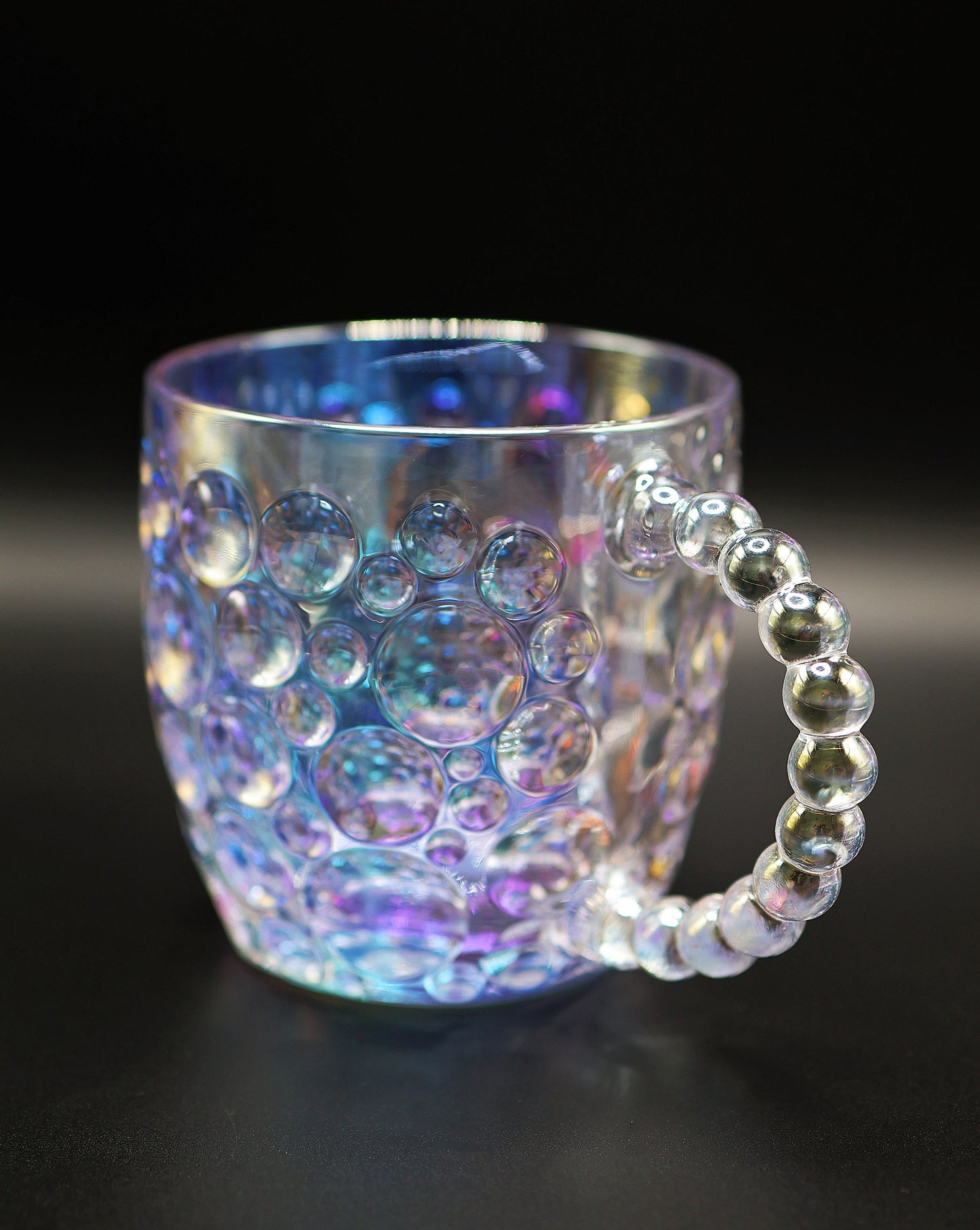 Close-up of the beaded pearl handle on the Dreamy Luster Glass Mug.