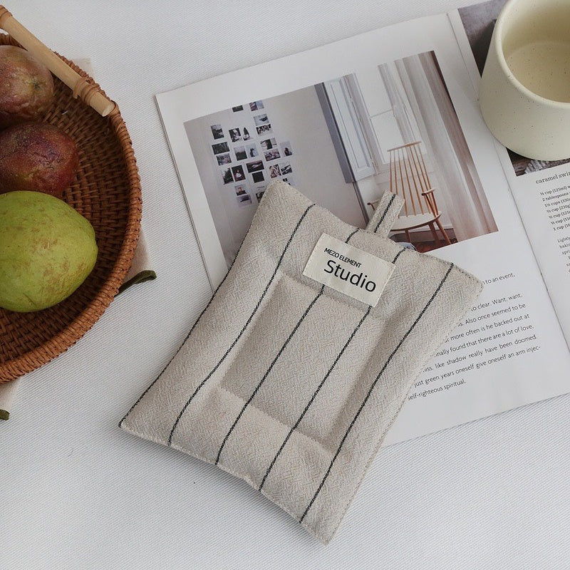 Japanese-inspired cotton linen coasters set with minimalist design on a wooden table.
