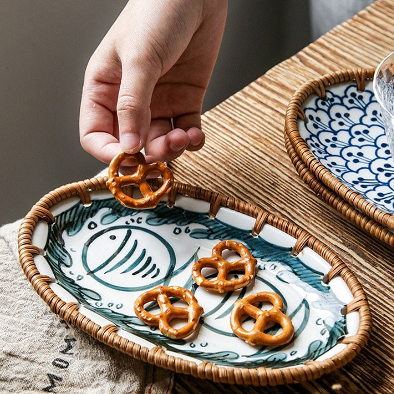 Japanese rattan snack plate showcasing intricate hand-painted patterns and natural textures.