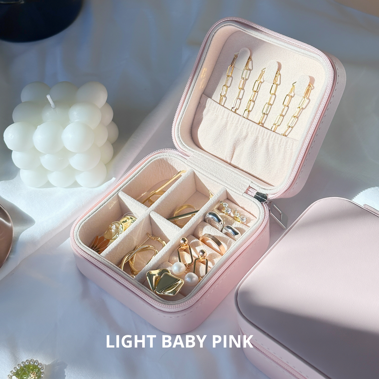Baby pink and cherry pink jewelry organizers side by side, showcasing trendy color options