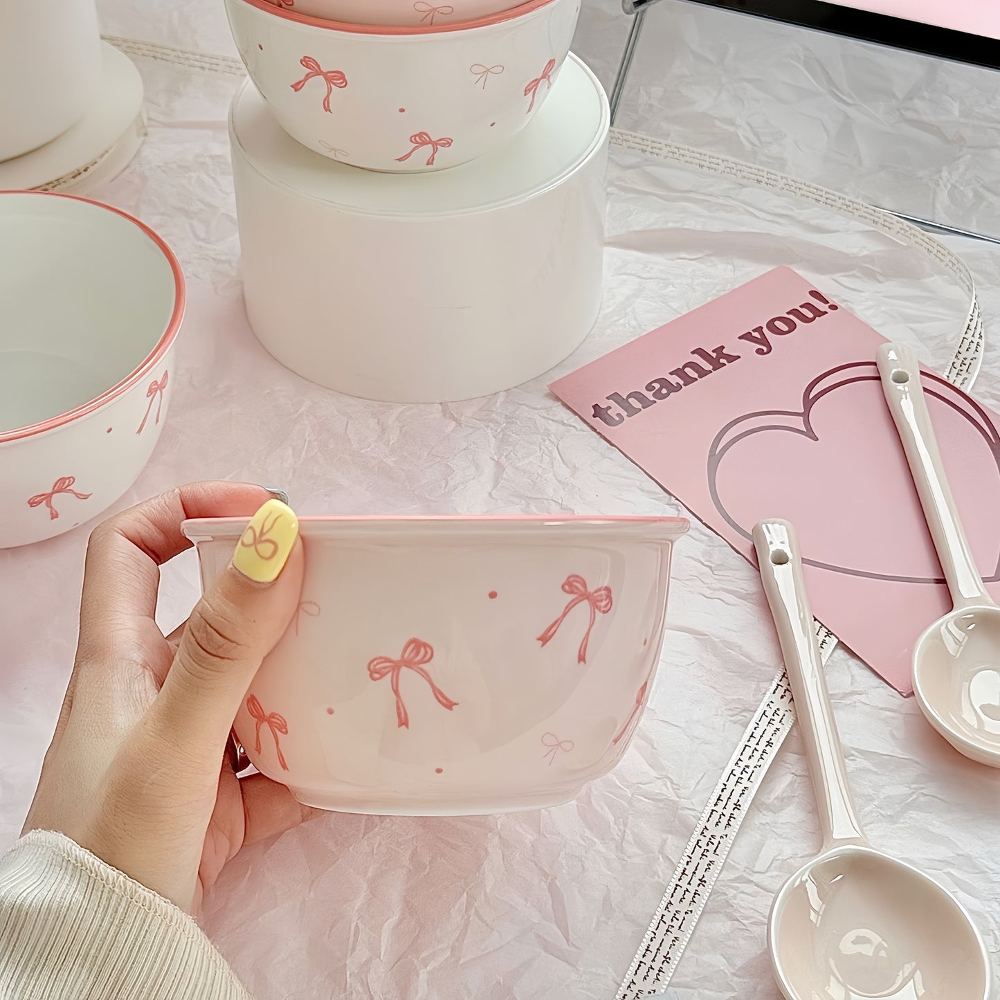 Matching pink ceramic spoon with bow handle - elegant tableware accessory