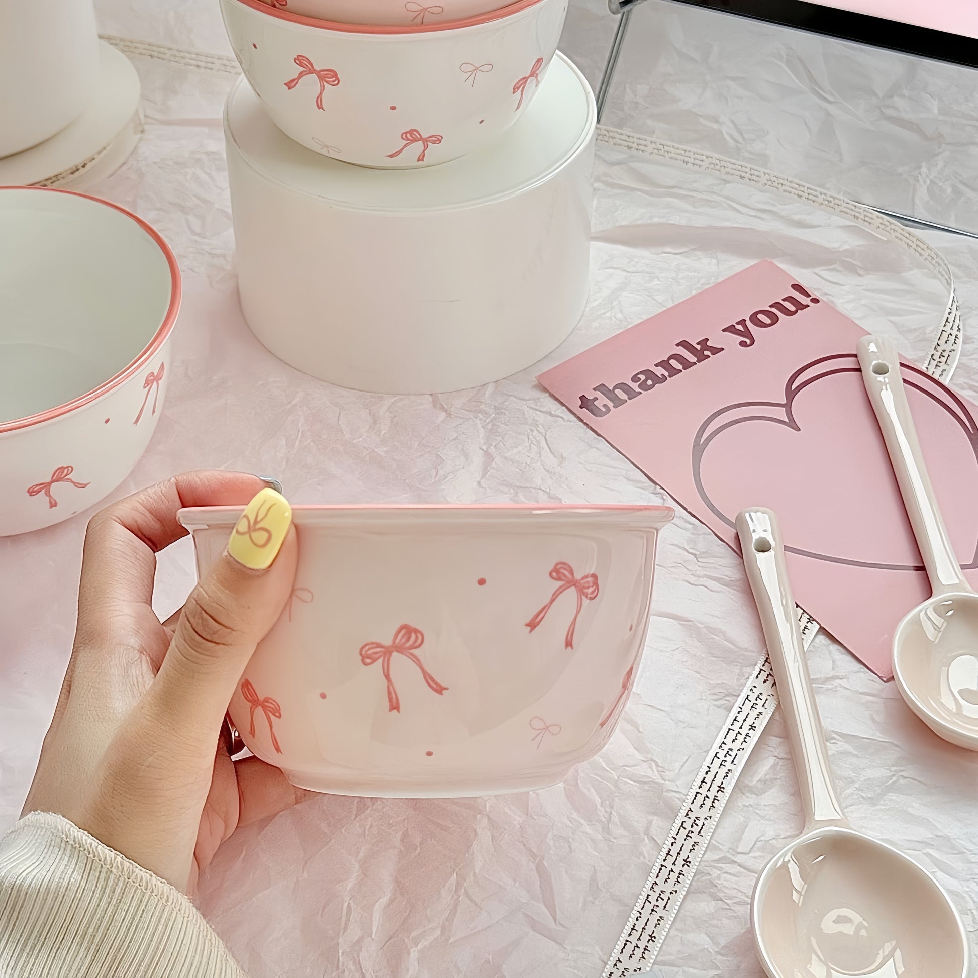 Matching pink ceramic spoon with bow handle - elegant tableware accessory