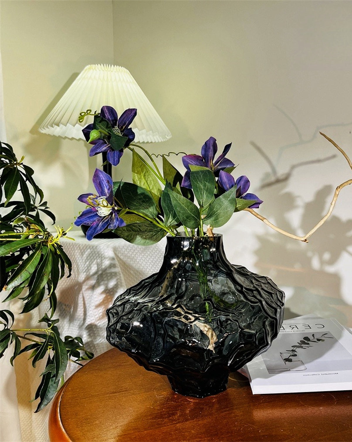 Handmade glass vase filled with flowers, adding a natural touch to any space.