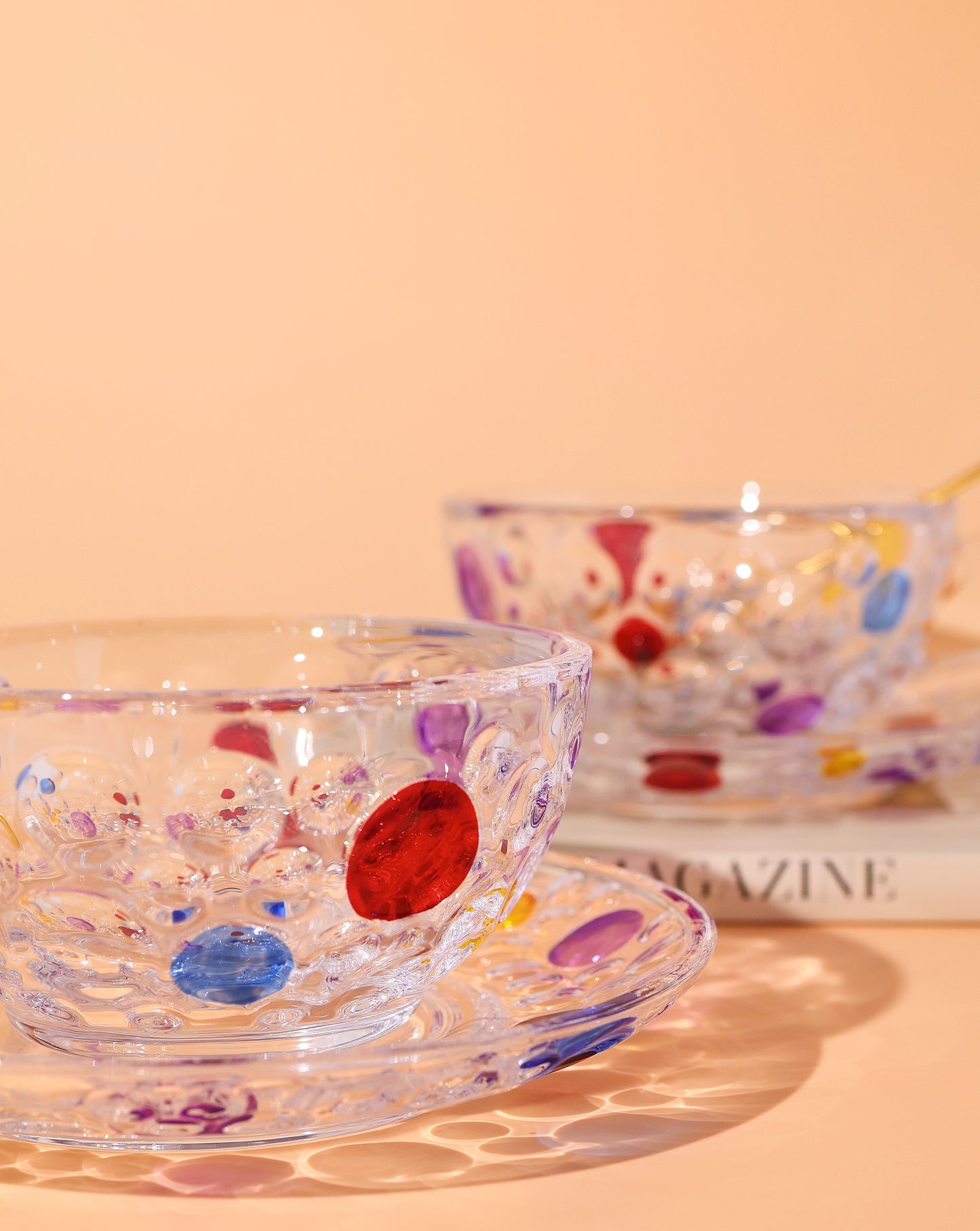 Close-up of the polka dot glass cup, showcasing its dazzling diamond-like effect under light.