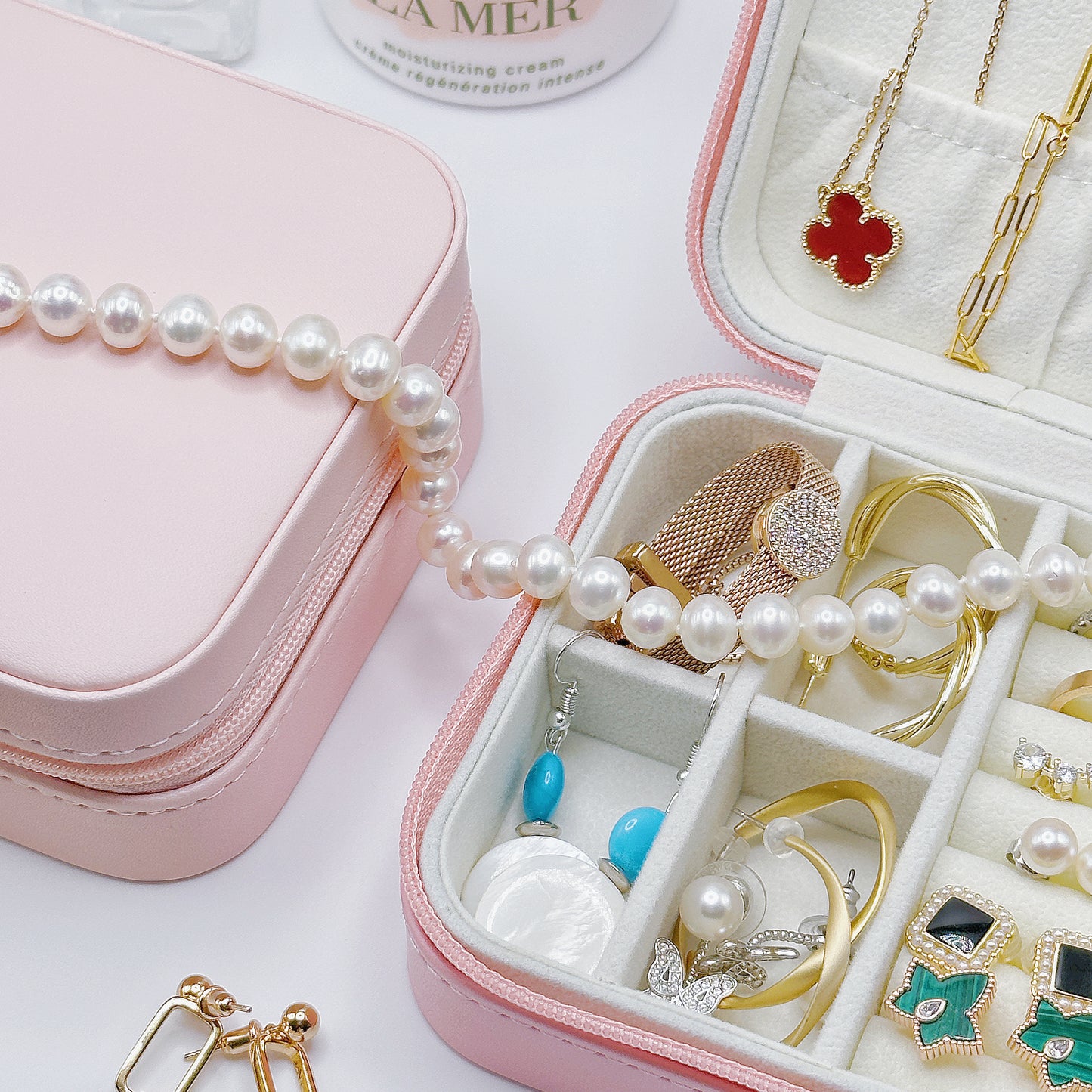 Compact jewelry case filled with earrings, bracelets, and necklaces, showcasing spacious design