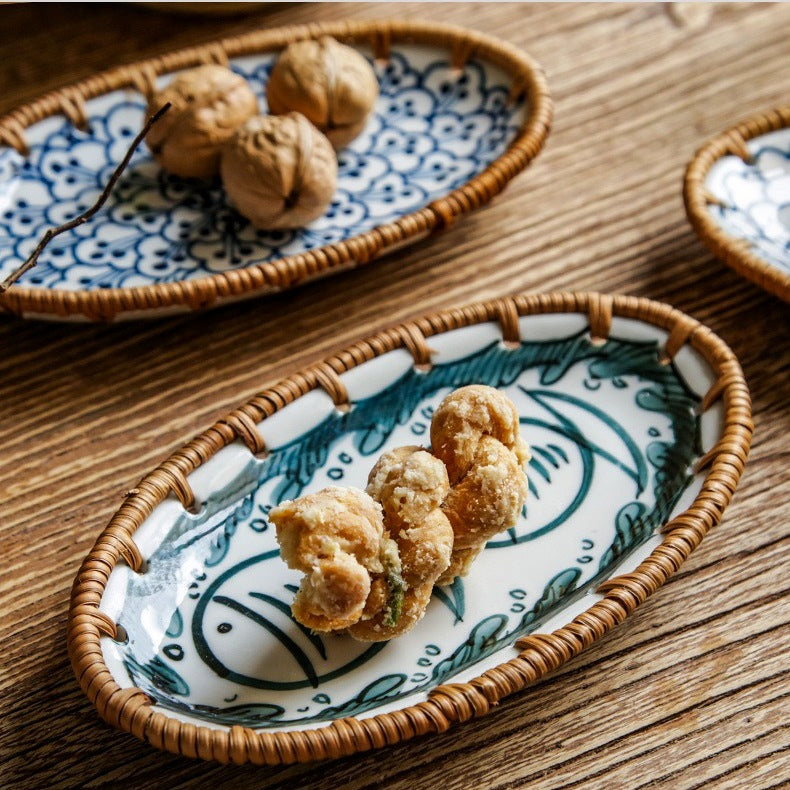 Skilled artisan hand-painting a rattan snack plate using traditional techniques