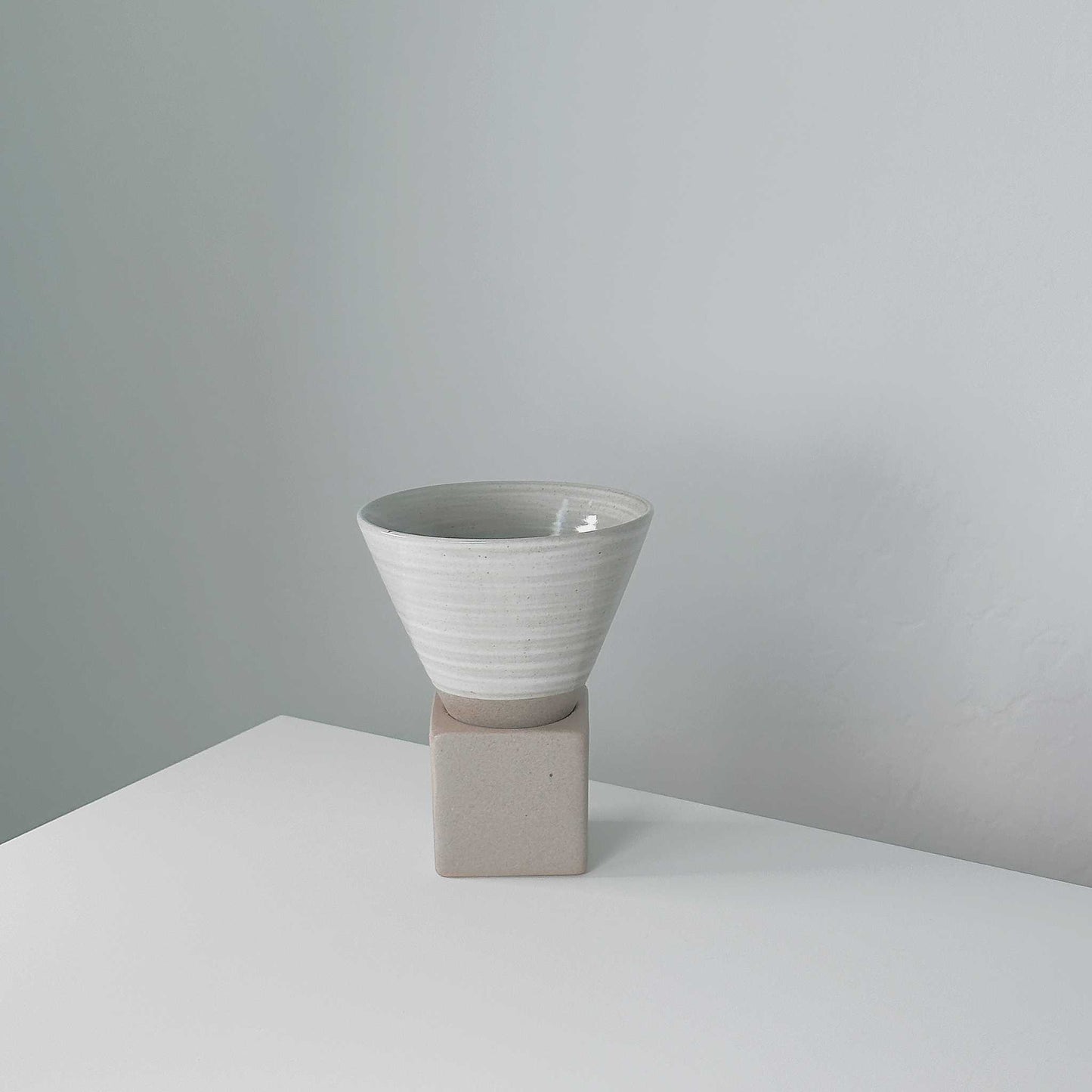 Hand-painted cup in a boho-inspired home, complementing eclectic and artistic decor.
