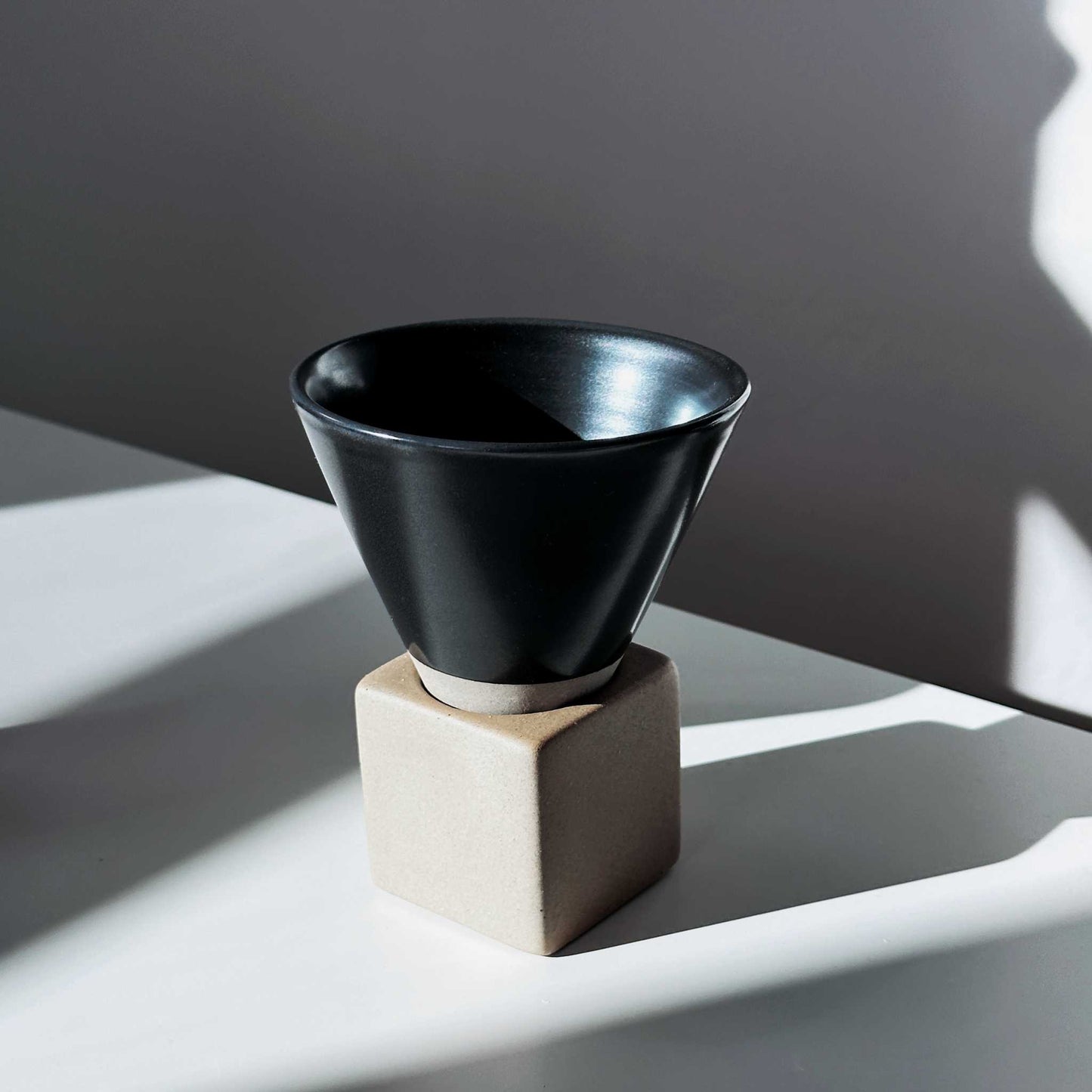 Ceramic cup in a minimalist home setting, blending seamlessly with clean, modern decor.