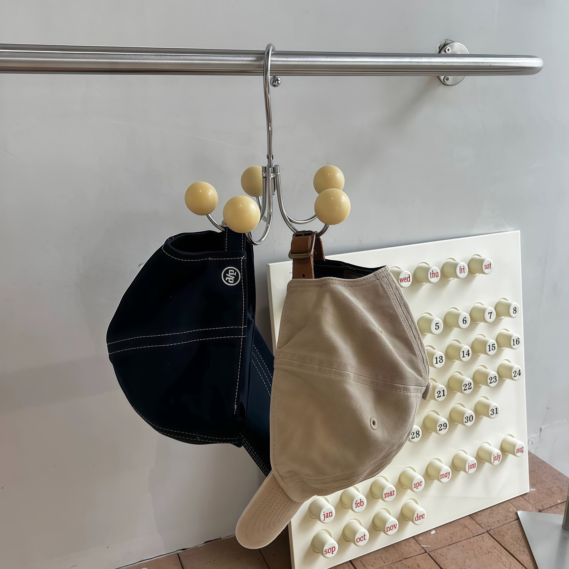 Organize your clothes and accessories effortlessly with our Sphere Rotating Closet Organizer. Featuring a sturdy metal frame, six painted wooden spheres, and a 360° rotating hook, this stylish and durable hanger is perfect for purses, scarves, hats, and more. Ideal for closets, entryways, or bedrooms, it adds elegance and convenience to any space.