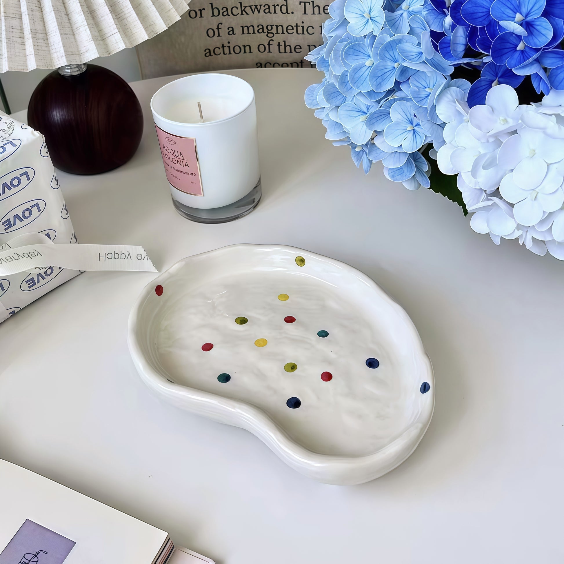 Close-up of the glossy finish on a polka dot decorative tray with hand-painted design.