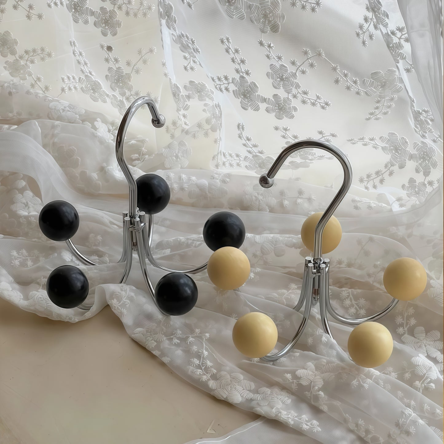 Sphere Rotating Closet Organizer with a metal frame and painted wooden spheres, perfect for hanging clothes and accessories.