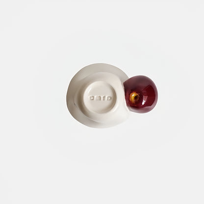 Cup filled with steaming latte, showcasing spacious capacity and ceramic finish.