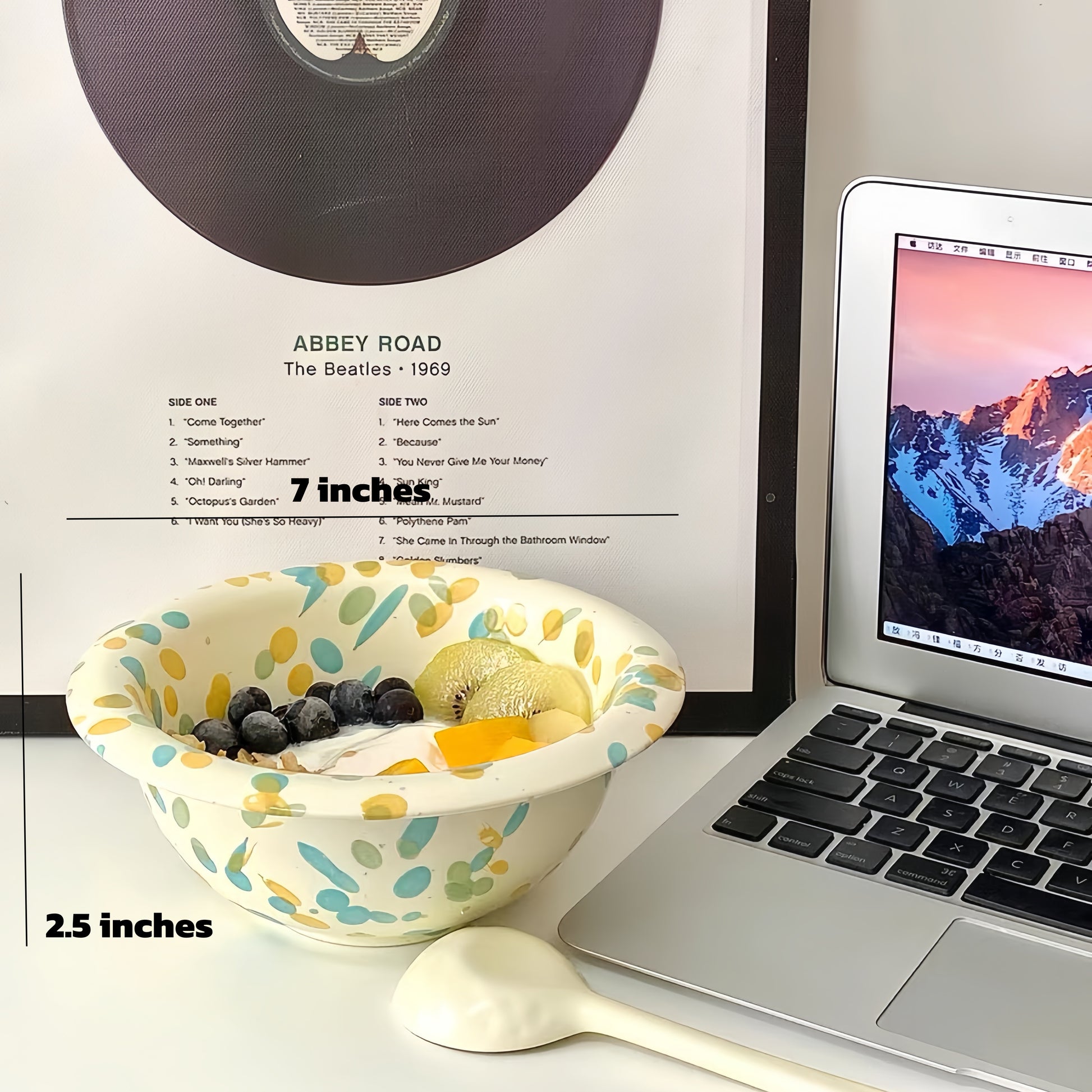 Creamy yogurt in a vibrant bowl topped with mango, coconut shavings, and passion fruit.