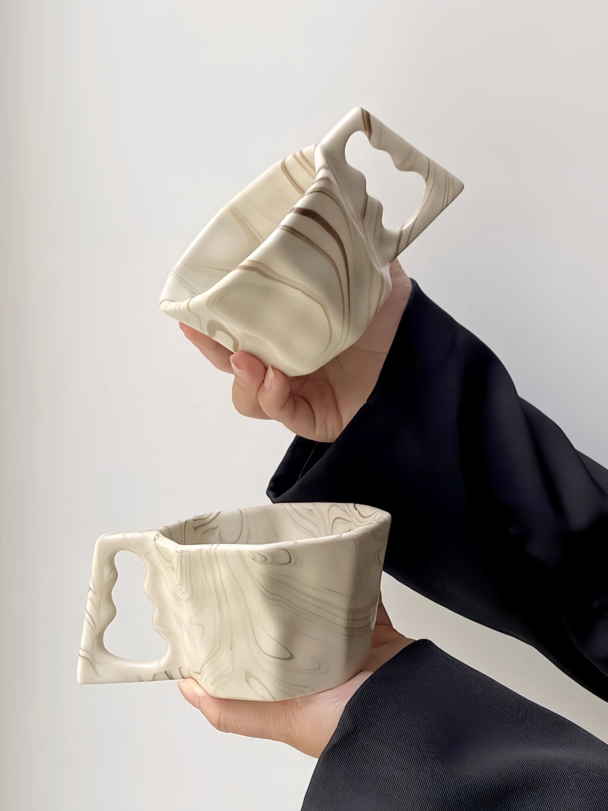 Artisan Flow Octagonal Coffee Cup in soft ivory – minimalist ceramic mug with ink-wash textures.