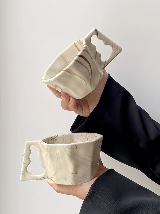Artisan Flow Octagonal Coffee Cup in soft ivory – minimalist ceramic mug with ink-wash textures.