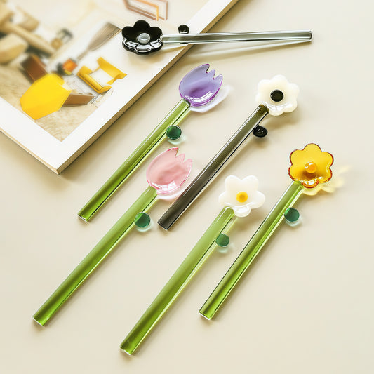 Artisan hand-blown borosilicate glass spoon on a table.