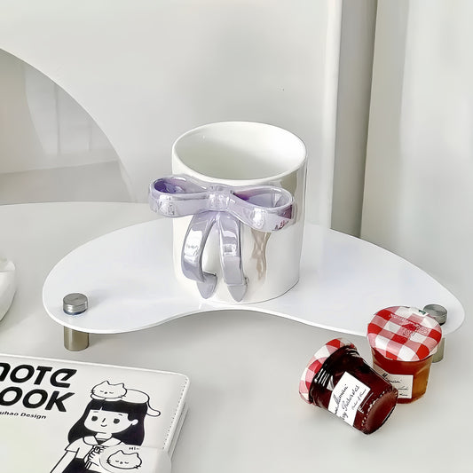 Elegant Lavender BowKnot Mug with light-catching pearl glaze on a table