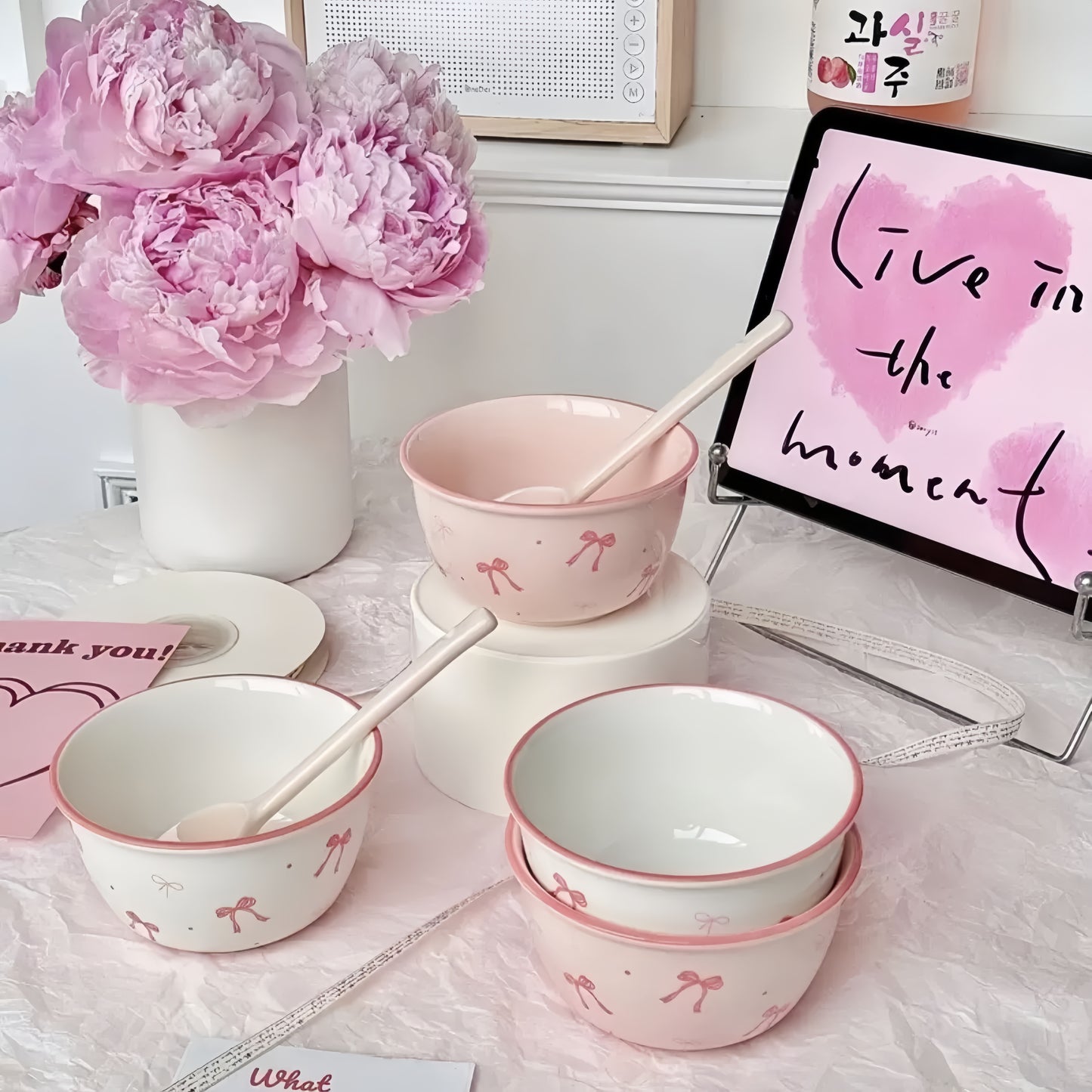 Elegant table setting with pink bow ceramic dishes - sophisticated dining collection