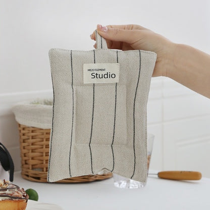 Space-saving linen coasters with hanging loop for vertical or hook storage.
