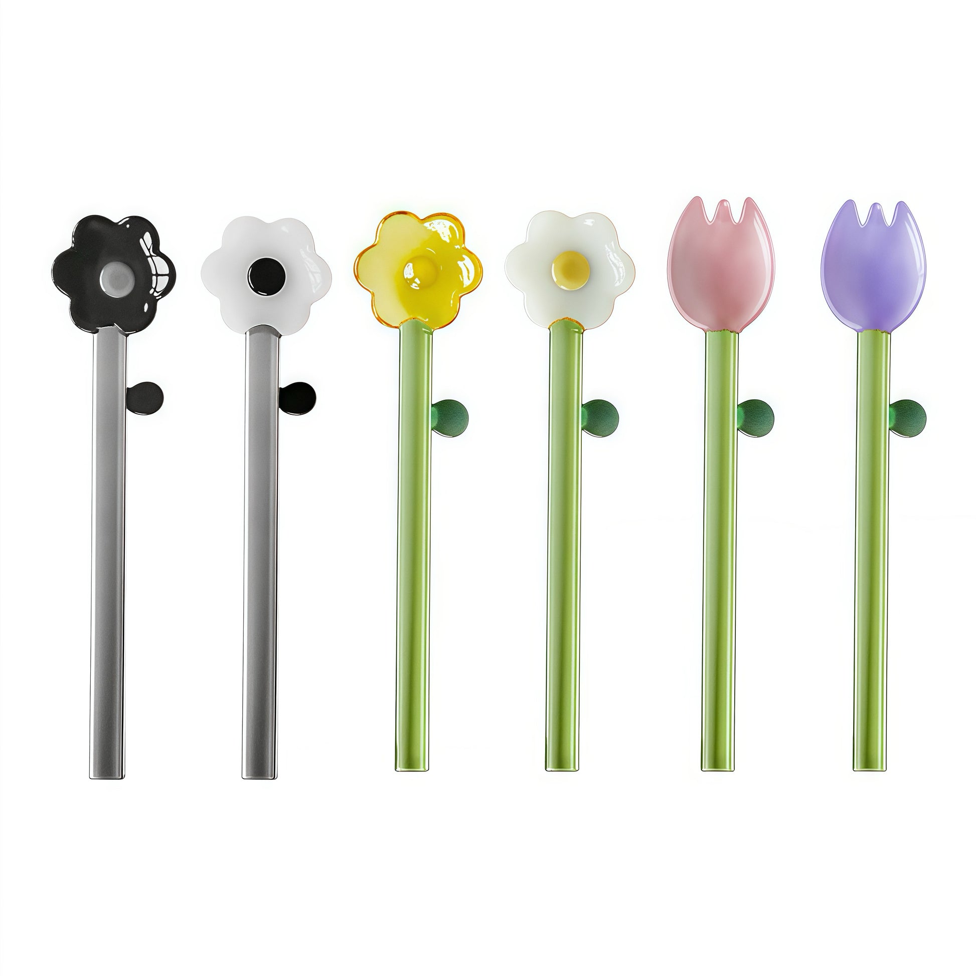 Close-up of a daisy-designed borosilicate spoon stirring a green matcha latte in a white cup.