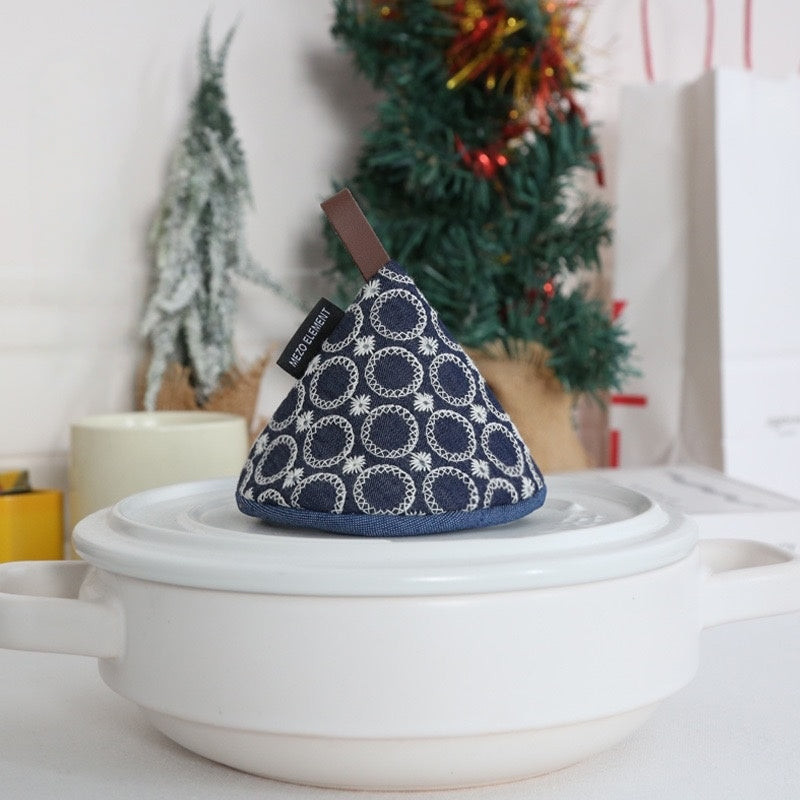  Intricate Japanese-inspired hand-stitched patterns on cotton pot cap, combining aesthetics and functionality.
