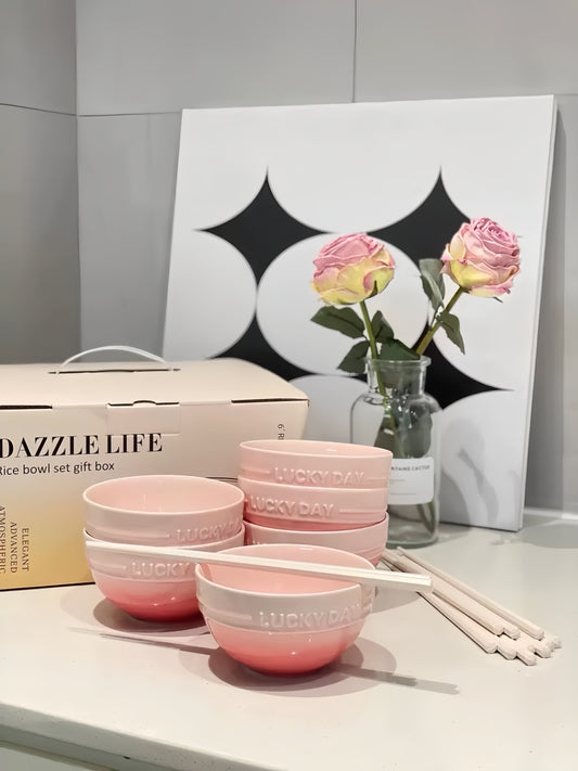 Sakura Macaron ceramic 4-piece set: 4 pink gradient bowls with 4 matching chopsticks on wooden table